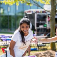Professor conversing with students